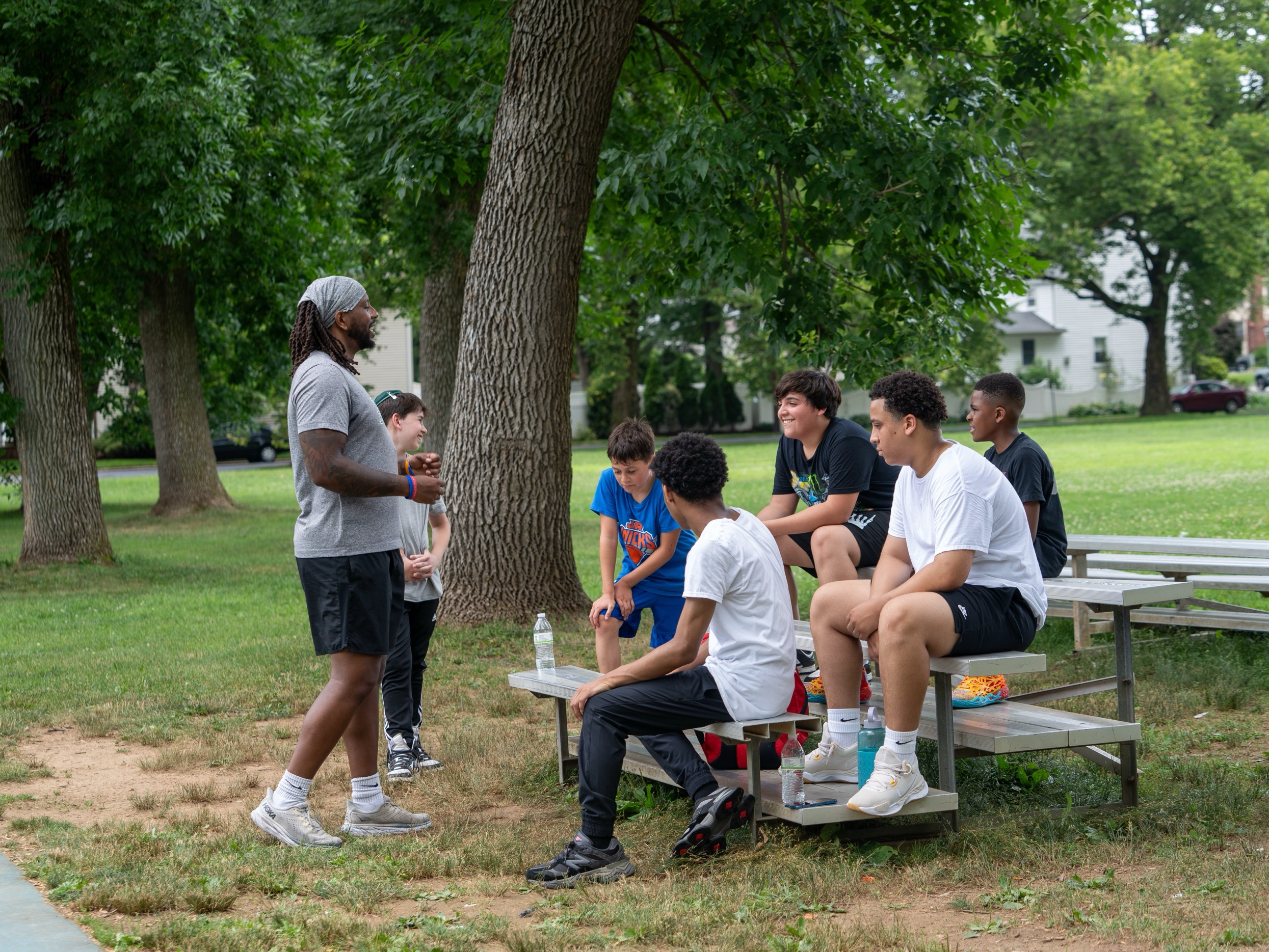 Coach leading character development huddle at Different Breed Elite Fitness